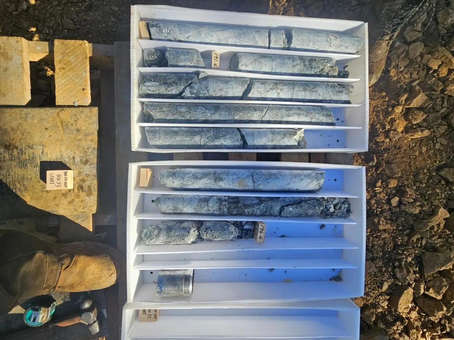 Drill core exhibiting structural transitions and competency changes